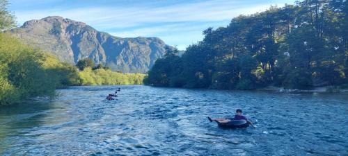Kids doing easy rafting on inner tubes